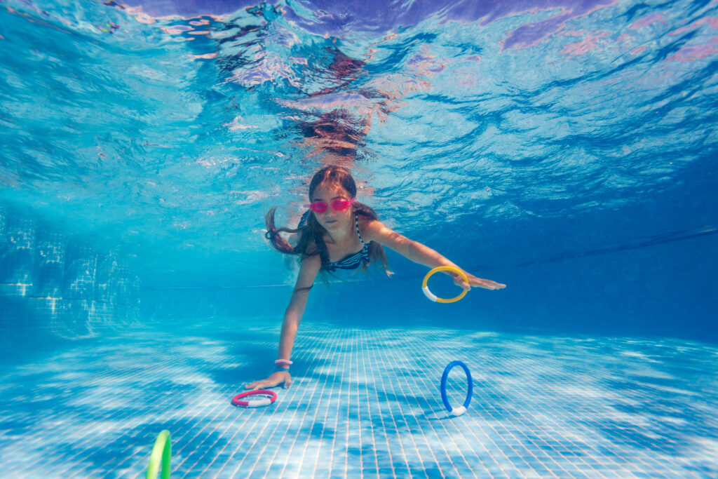Child diving in pool